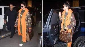 Deepika Padukone follows all guidelines for relaxed airport attire with her baggy camouflage suit and little makeup